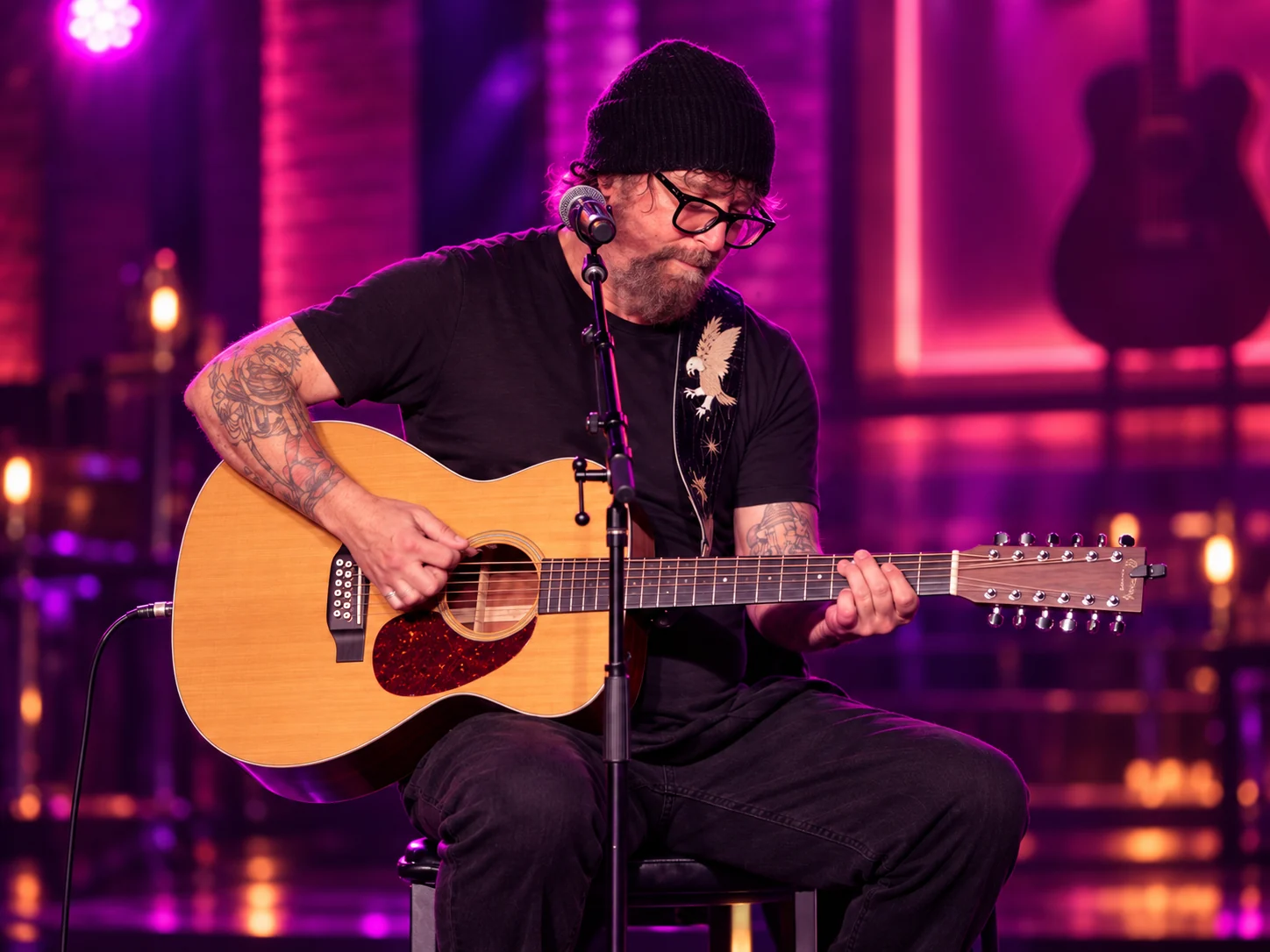 Chris Amodeo performing with acoustic guitar — editorial illustration