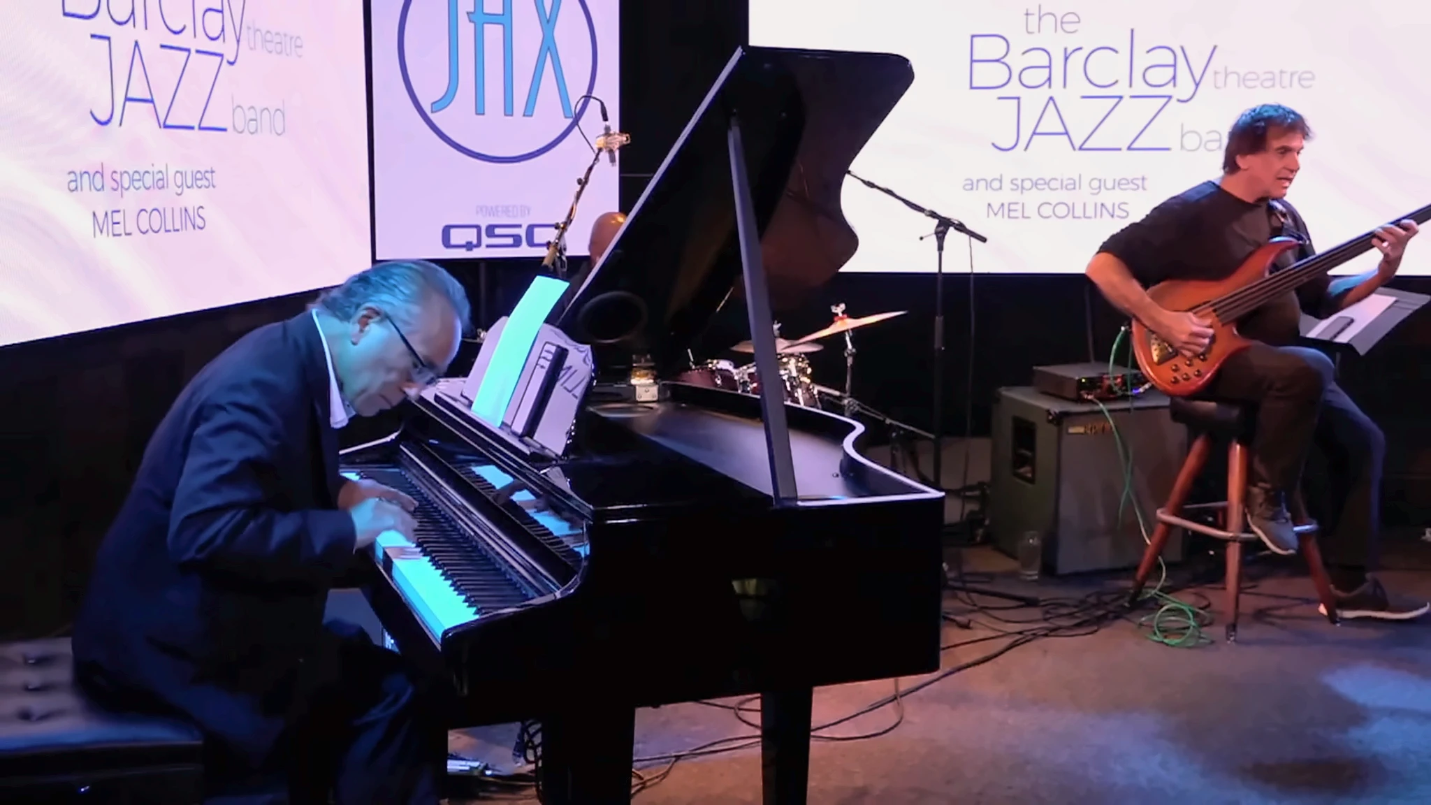 Ron Kobayashi playing grand piano with a bassist during an Irvine Barclay Theatre Jazz Band performance at Campus JAX