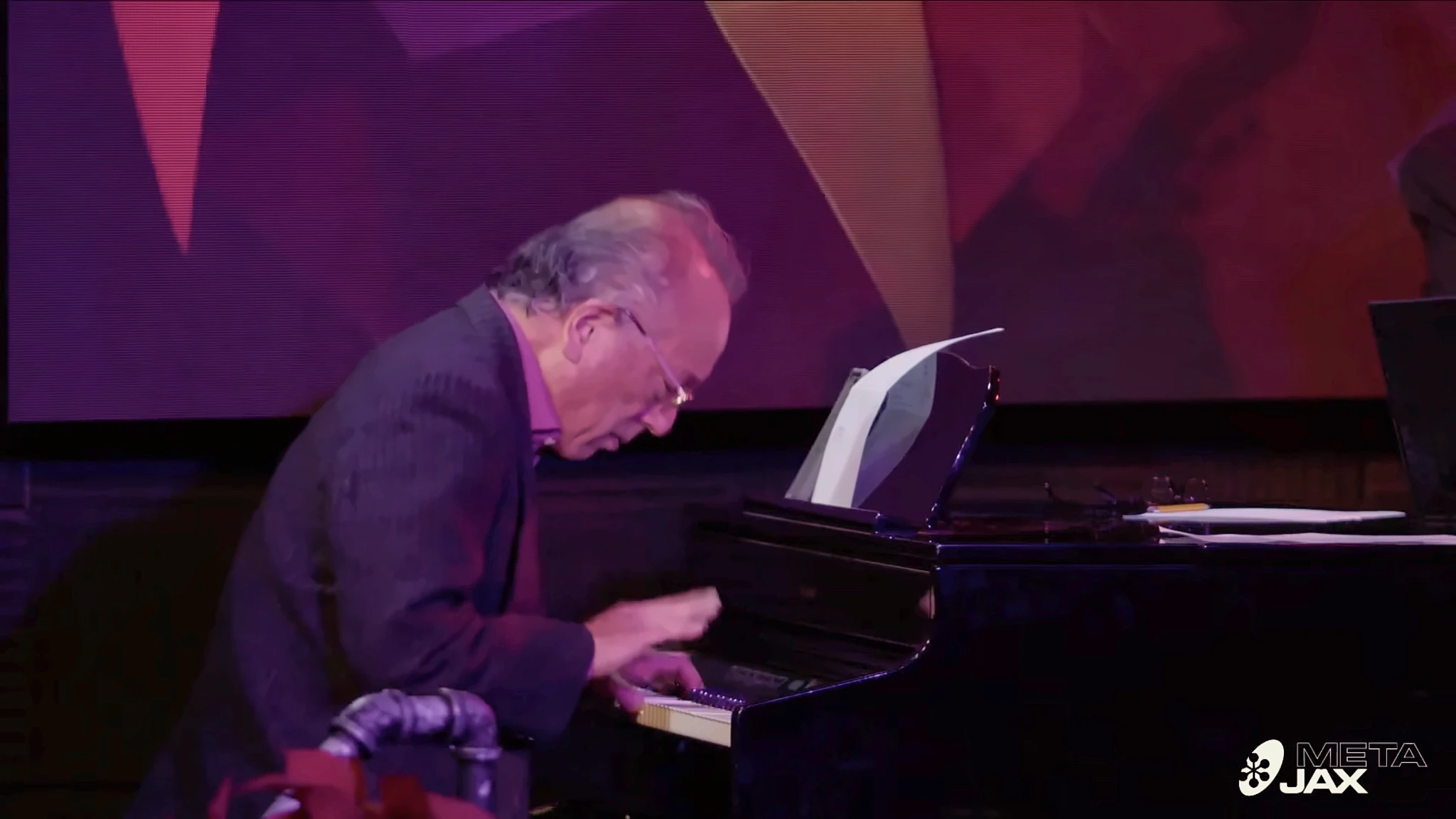 Ron Kobayashi leaning into an expressive solo at the piano at Campus JAX