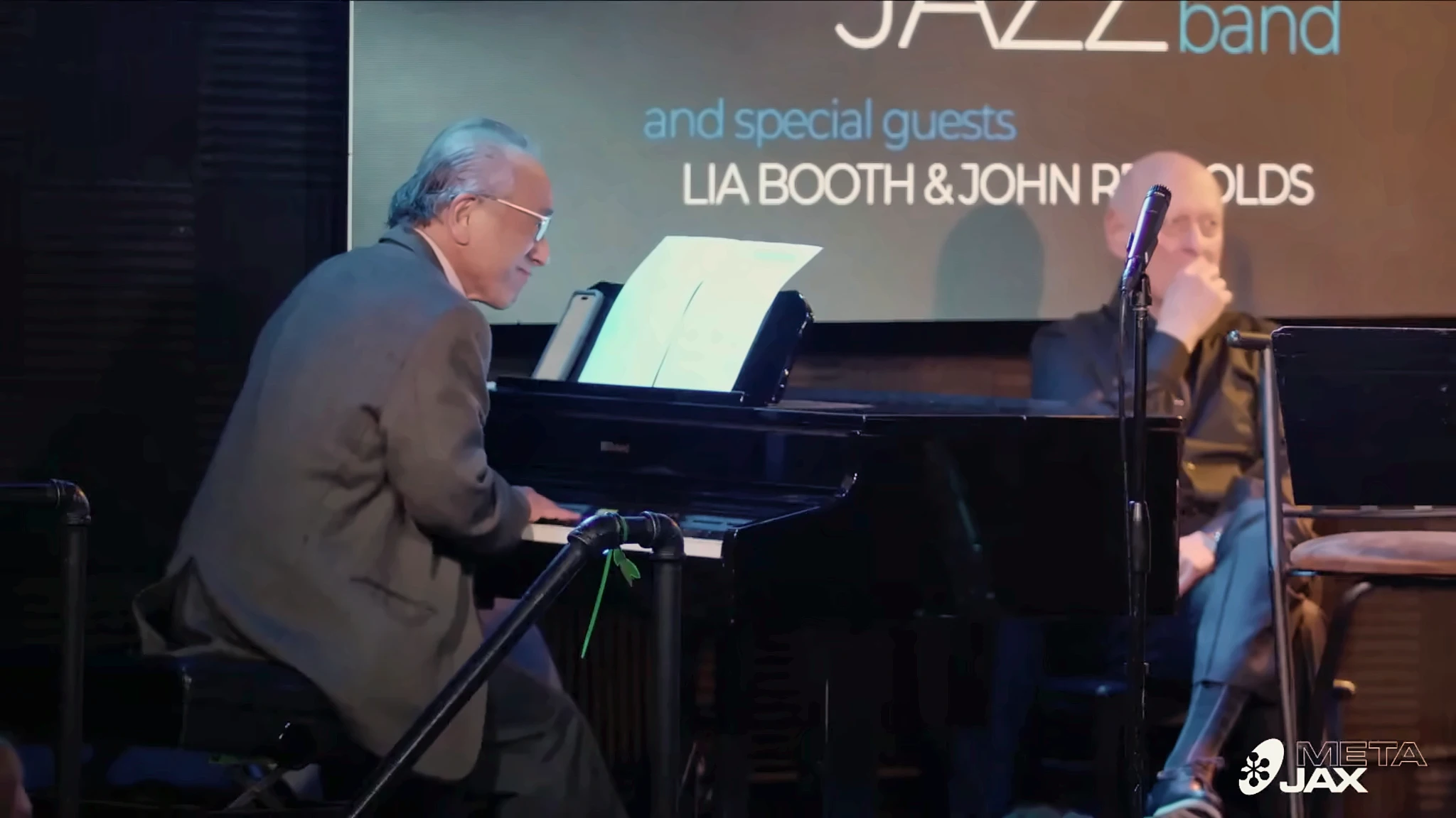 Ron Kobayashi playing piano with a guest vocalist at Campus JAX